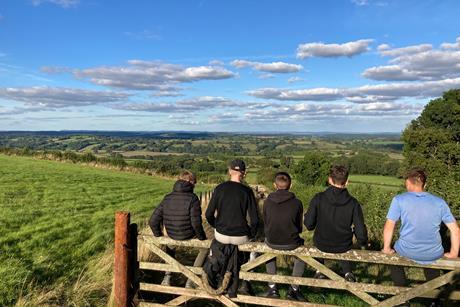 Students sat on a gate courtesy of the Ernest Cook Trust