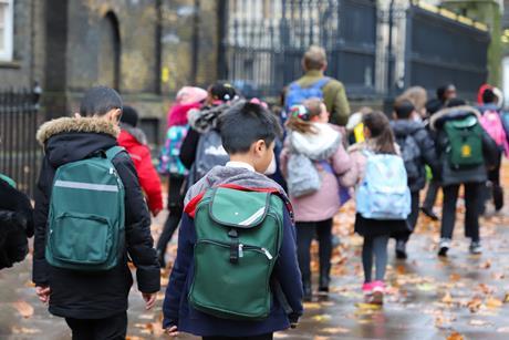 School group walking along street