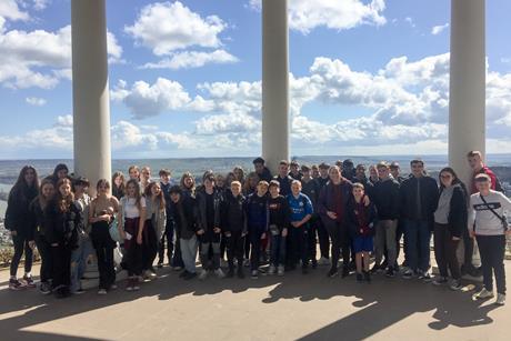 A school group pose for a photo at the Niederwald Monument