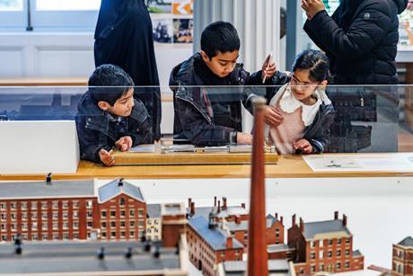Children explore an exhibition at The Harris, Preston