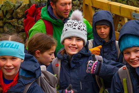 Young children looking happy on an outdoor residential.