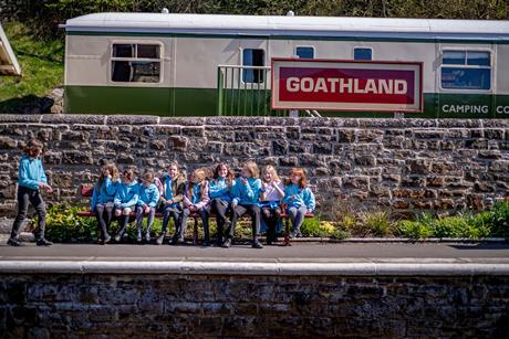 Children sat outside the Goathland Learning Coach