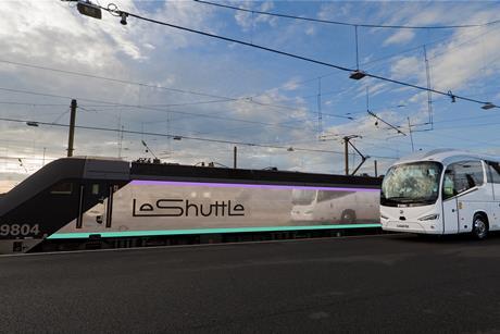 A coach next to a LeShuttle train