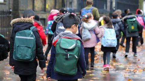 School group walking along street