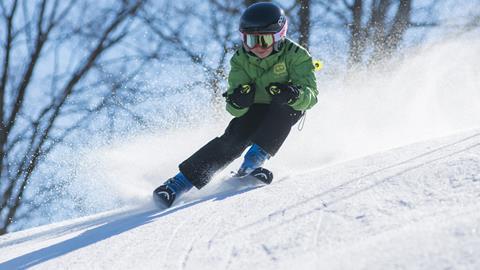 Pupil skiing on a school trip