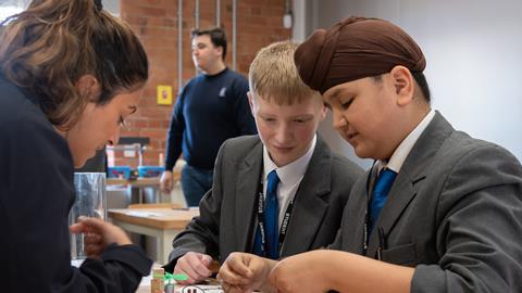 Students put a piece of equipment together at the Derwent Valley Museum of Making