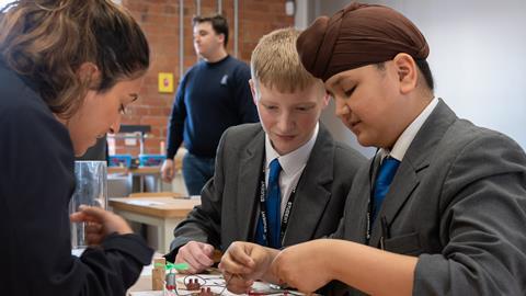Students put a piece of equipment together at the Derwent Valley Museum of Making