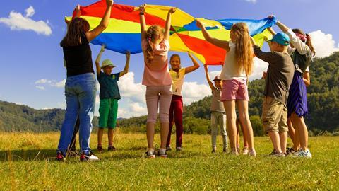Pupils using a parachute in nature