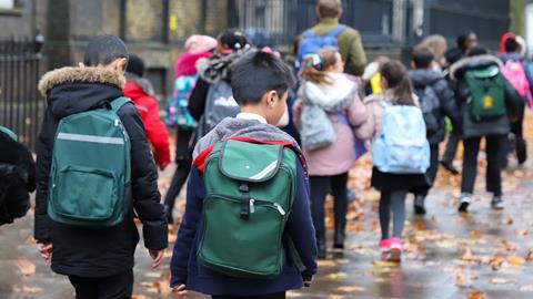 School group walking along street