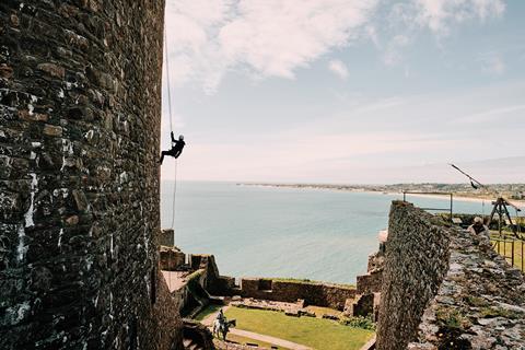 Somebody abseils off Mont Orgueil Castle in Jersey