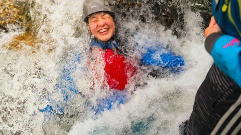 One pupil immersed in water on an Outward Bound Trust residential