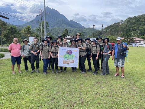 Walsall Academy students and staff show their banner during a Borneo expedition