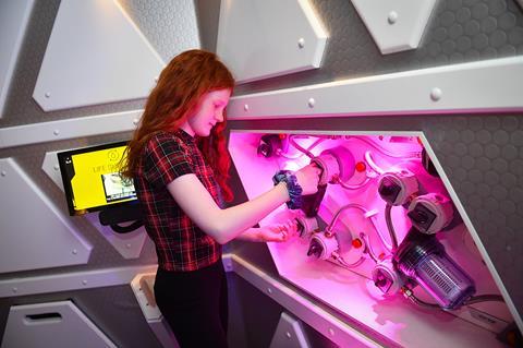 A teenage girl tries out the National Space Centre's new Mission to Mars experience