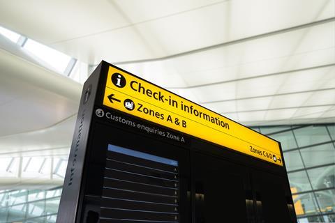 A check-in board at an airport