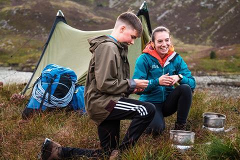 Two teenagers enjoying a camping trip with The Outward Bound Trust