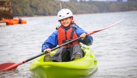 Pupil taking part in canoeing session at Conway Centres' Anglesey site