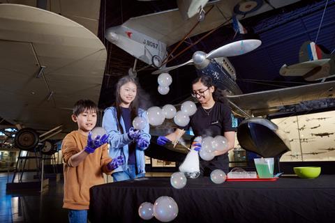 Visitors at a science demonstration at Astronights
