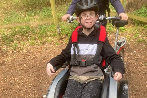 Pupils out and about in wheelchair on a residential