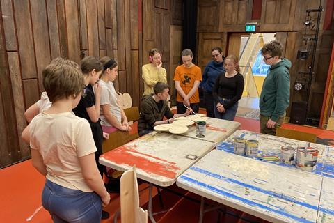 A group of students help create a display at The Story Museum