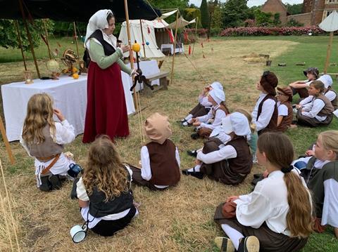 Pupils taking part in a Tudor Day event at Kentwell Hall in Suffolk