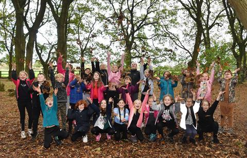 A group of children cheer during a residential with the YHA
