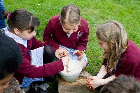 Children making butter at the Chiltern Open Air Museum