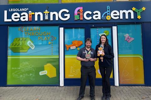 Legoland staff with their School Travel Awards trophy and Ted