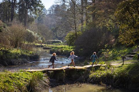 Children run along the stream at Leonardslee Lakes and Gardens