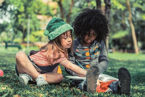 Children sitting in grass