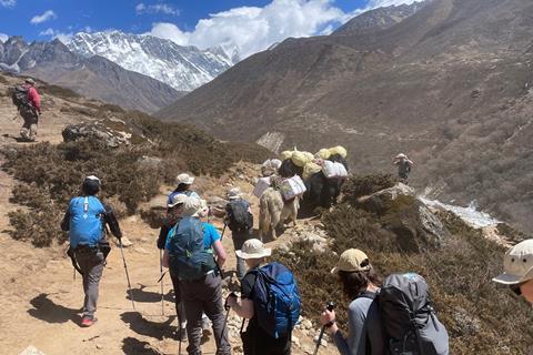 A group of students hiking in mountains