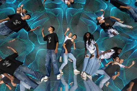 Group of people in a room surrounded by mirrors