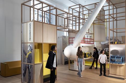 Young people in a museum exhibit about engineering