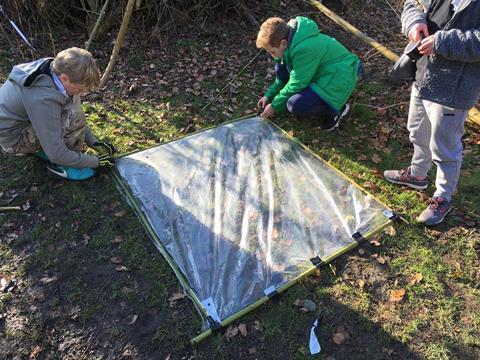 Pupils building a shelter