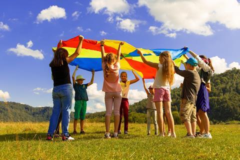 Pupils using a parachute in nature