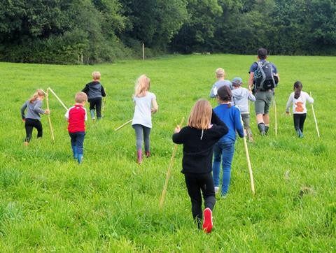 Children field walking at Bore Place, Kent