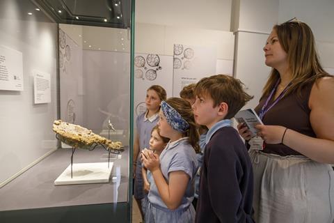 Melsonby Primary pupils look at the Iron Age mirror from the Melsonby Hoard