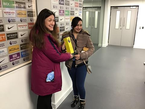 Pupils with Premier League Man of the Match trophy