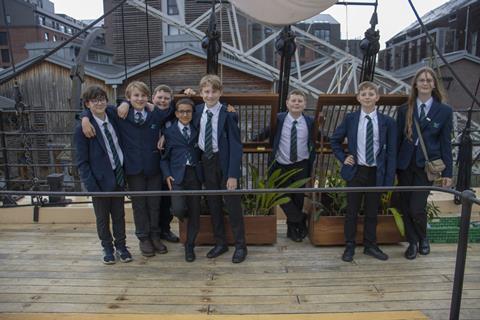 A group of children planting orchids aboard SS Great Britain in Bristol