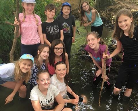 Pupils pond dipping at Everdon Outdoor Learning Centre in Northamptonshire