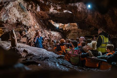 Kents Cavern staff with students