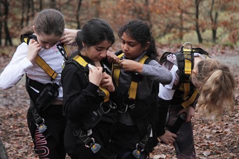 Young girls get kitted up for an outdoor activity with the Brathay centre