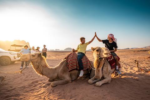 Children on a camel ride in Jordan