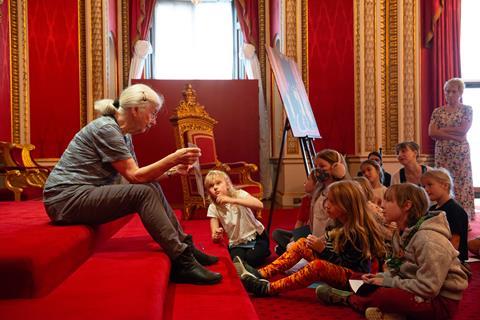 School pupils inside the Throne Room at Buckingham Palace during Schools Week