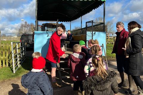 Children from Ferncumbe Church of England School boarding tractor