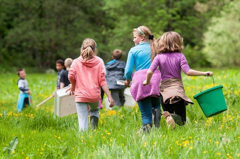 Children from Dulverton School release salmon fry in the River Haddeo.