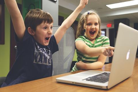 Children playing on laptop