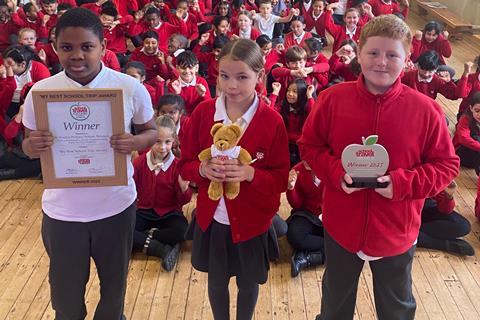 St Woolos Primary School children with their 'My Best School Trip' Award certificate and trophy
