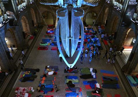 Children sleeping in the Hintze Hall at the Natural History Museum in London
