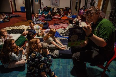 Students enjoying a bedtime story at Whipsnade Zoo