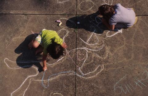 Children creating pavement art